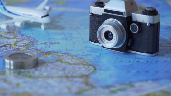 travel accessories and toy plane on world map background vacation planning hsgzbn75ux thumbnail full01 b16cd