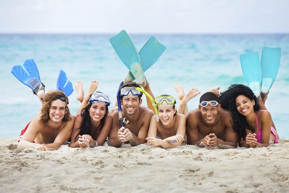 group of friends on the beach gulf shores policies 8bd8e